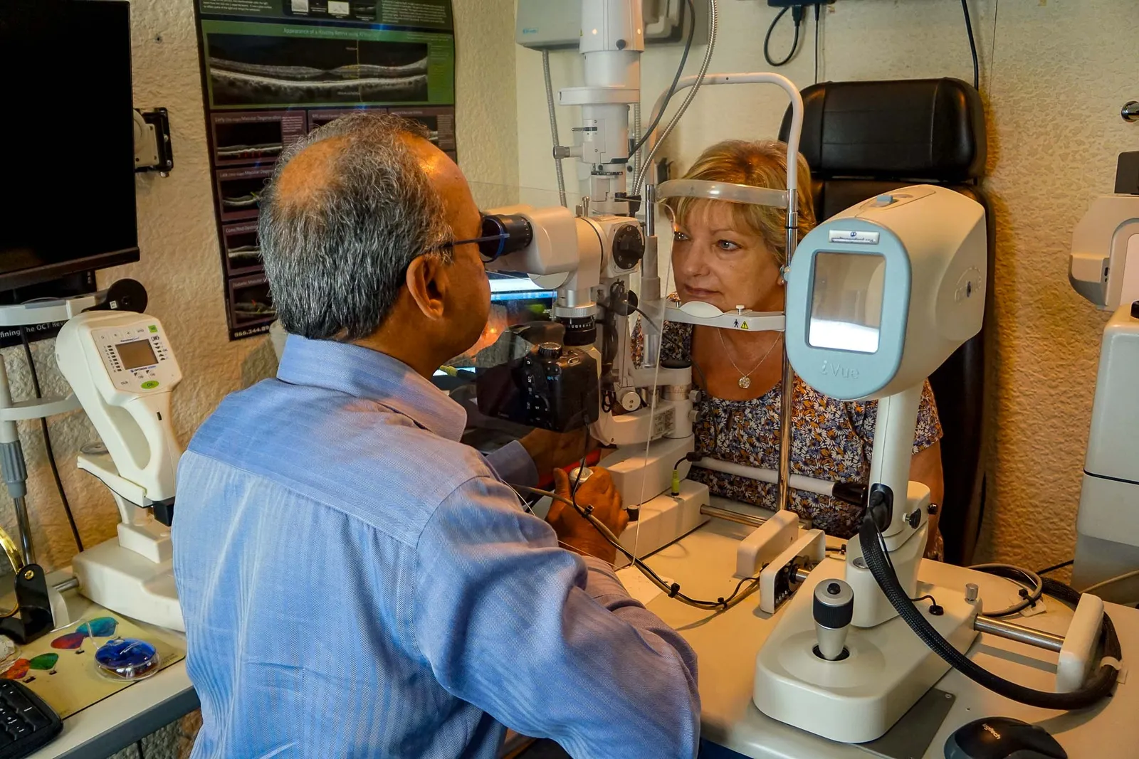 An optometrist examining a patient at the slit lamp during an eye examination at Nu-Sight